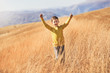 © Mediteraneo - Lovely blonde boy in a yellow sweater having fun on country walk in autumn.
