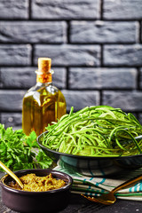 Wall Mural - spiralized Zucchini pasta in a black bowl