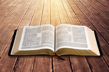 Poster - Open vintage book on wooden desk