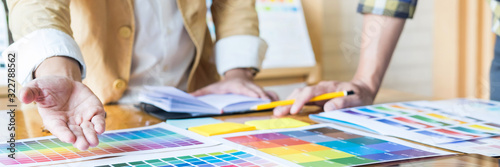 Fotografía Professional Creative architect graphic desiner occupation choosing the Color pantone palette samples for project on office desktop computer