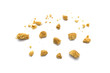 Scattered crumbs of butter cookies on white background.