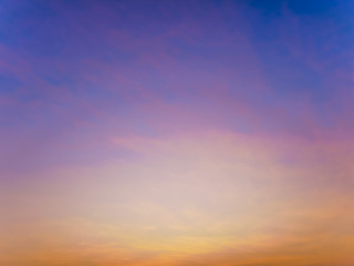 Wall Mural - Fantasy twilight dawn blurred abstact background, Gold sunlight on blue sky and moving soft purple clouds before sunset
