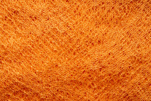 Mesh Fabric.Orange Mesh Texture. Light Working Background.