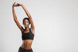 Fototapeta  - Image of athletic african american woman stretching her arms