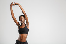 Image Of Athletic African American Woman Stretching Her Arms