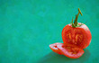 Fresh red tomatoes sliced on green color background.- oil painting