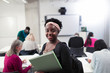 © Sam Edwards/Caia Image - Portrait confident young female community college student in classroom