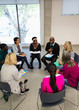 © Chris Ryan/Caia Image - People talking in support group meeting circle