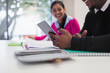 © Sam Edwards/Caia Image - Businessman using digital tablet in meeting