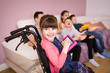 © Sam Edwards/Caia Image - Happy young girl in wheelchair using digital tablet
