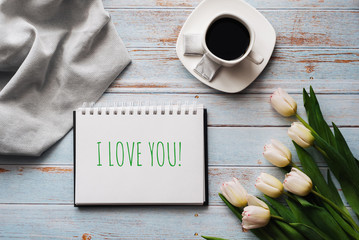 Wall Mural - Greeting card with the inscription I Love You. Bouquet of white Tulip flowers with a Cup of coffee