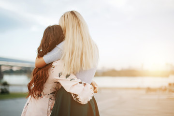 Back view of women lesbian happy couple waking. LGBT Lesbian couple together outdoors concept