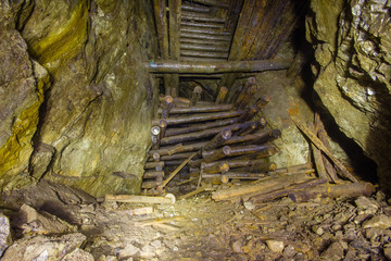 Massive wooden timbering in old copper mine underground tunnel