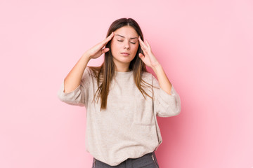 Wall Mural - Young caucasian woman posing isolated touching temples and having headache.