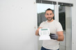 © W PRODUCTION - handsome man worker installing alarm technology insurance in home for burglar prevention