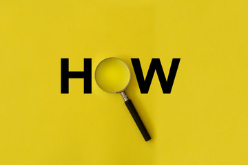 magnifying glass on yellow background, how word