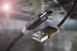 © Alexander - USB cable and USB type-C on an industrial background.