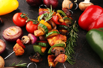 Wall Mural - Grilled pork shish or kebab on skewers with vegetables . Food background shashlik