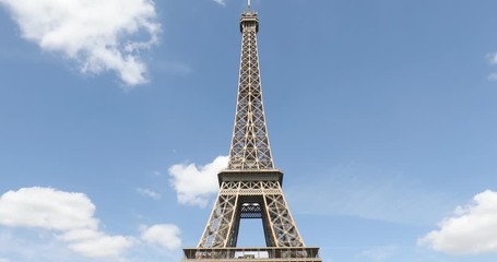 Wall Mural - Eiffel Tower in Paris in a sunny summer day with green trees, blue sky in France