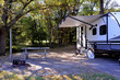 Travel trailer camping in the woods