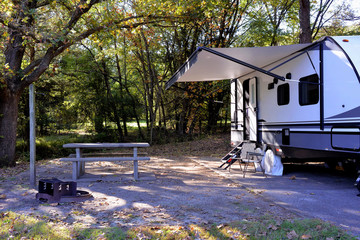 travel trailer camping in the woods