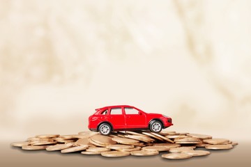 Wall Mural - Golden coins with a mini car on the desk