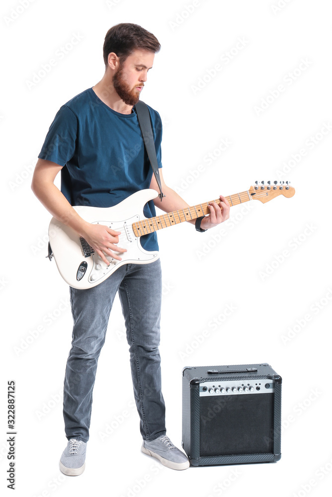 Young man playing guitar on white background
