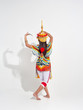 © Watcharin - Back side of Young lady wearing Thai Tradition southern costume and headdress on her head,showing basic pattern folk dance,black shadow reflection on white background