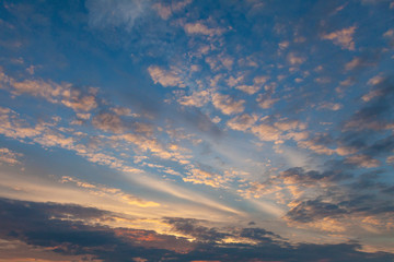 Golden evening clouds against a blue sky