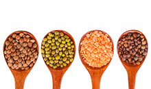 Collection Of Various Lentils In A Wooden Spoons Isolated On A White Background. Top View.