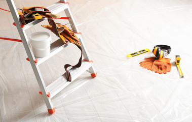 Canvas Print - Stepladder and different tools in room. Interior renovation