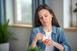 © zinkevych - Young woman llooking at the pills container