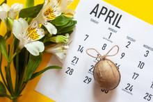 Happy Easter April 2020 Calendar Colorful With An Easter Egg. Easter Festive Holidays Concept. April 2020 Monthly Calendar With An Easter Egg On The Bright Yellow Background. View From Above