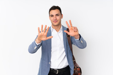 Young handsome businessman on isolated background counting eight with fingers