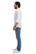 © studioloco - Casual Young Man Is Standing Relaxed And Smiling. Side View.
