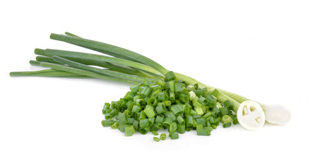 Wall Mural - Sliced green onions on a white background.