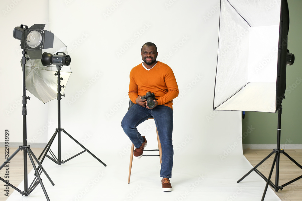 African-American photographer in modern studio