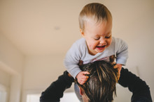 Happy Smiling Baby Playing With His Her Father