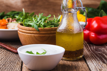 Wall Mural - Greek yogurt and homemade salad dressing, preparing fresh salad