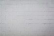 © Ursula Page - White painted cement concrete block wall with varying shades of white, off white and gray