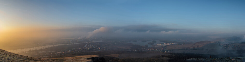 Wall Mural - Sunrise time on Radobyl hill over valley of river Labe and Lovosice town