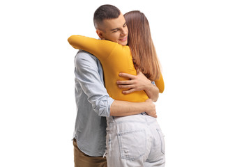 Wall Mural - Young female hugging a guy