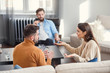 © gorynvd - Depressed young couple of man and woman speaking with psychologist on therapy session in modern office. Bad relationships without future.