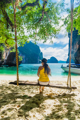 Wall Mural - Traveler woman in bikini relaxing on swing joy nature scenic landscape Lao Lading island beach, Attraction landmark tourist travel Krabi Phuket Thailand summer vacation trips, Tourism destination Asia