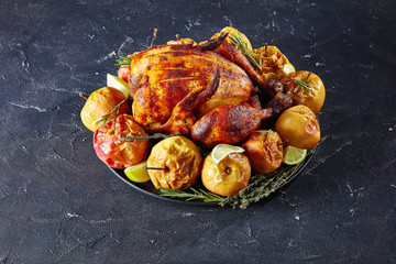 Canvas Print - roasted chicken served on a black platter