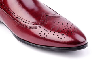 Local close-up of wine red leather shoes and toe caps