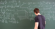 © Mihail - male person writing text with piece of chalk on blackboard, doing maths and physics equations