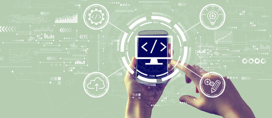 Web development concept with person holding a white smartphone