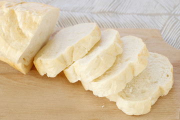 Sticker - Sliced bread on wooden cutting board.