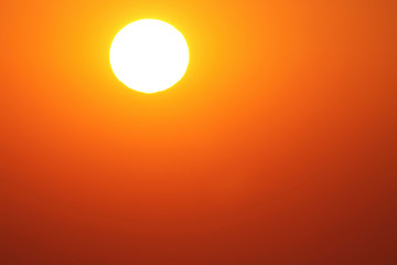 white sun of desert. bright dazzling white sun in a clear red sky
